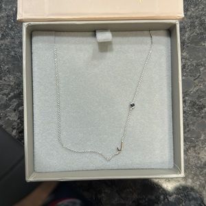 Maya Benner Initial “J” Necklace with blue gemstone.